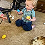 Colton joined the competition — help win amazing prizes! toddler, child, curly_hair, plastic_eggs, carpet, vacuum_cleaner, indoor, furniture, wooden_drawer, blue_shirt, pants, barefoot, floor, toy, playing, young_child, person, home, curious, sitting