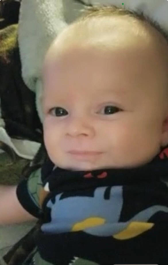 Colton is registered to the contest to win money with this photo: baby, baby_carriage, baby_products, baby_toddler_clothing, cheek, child, chin, eyebrow, eyelash, fun, hairstyle, happy, iris, mouth, nose, person, personal_protective_equipment, sitting, skin, smile