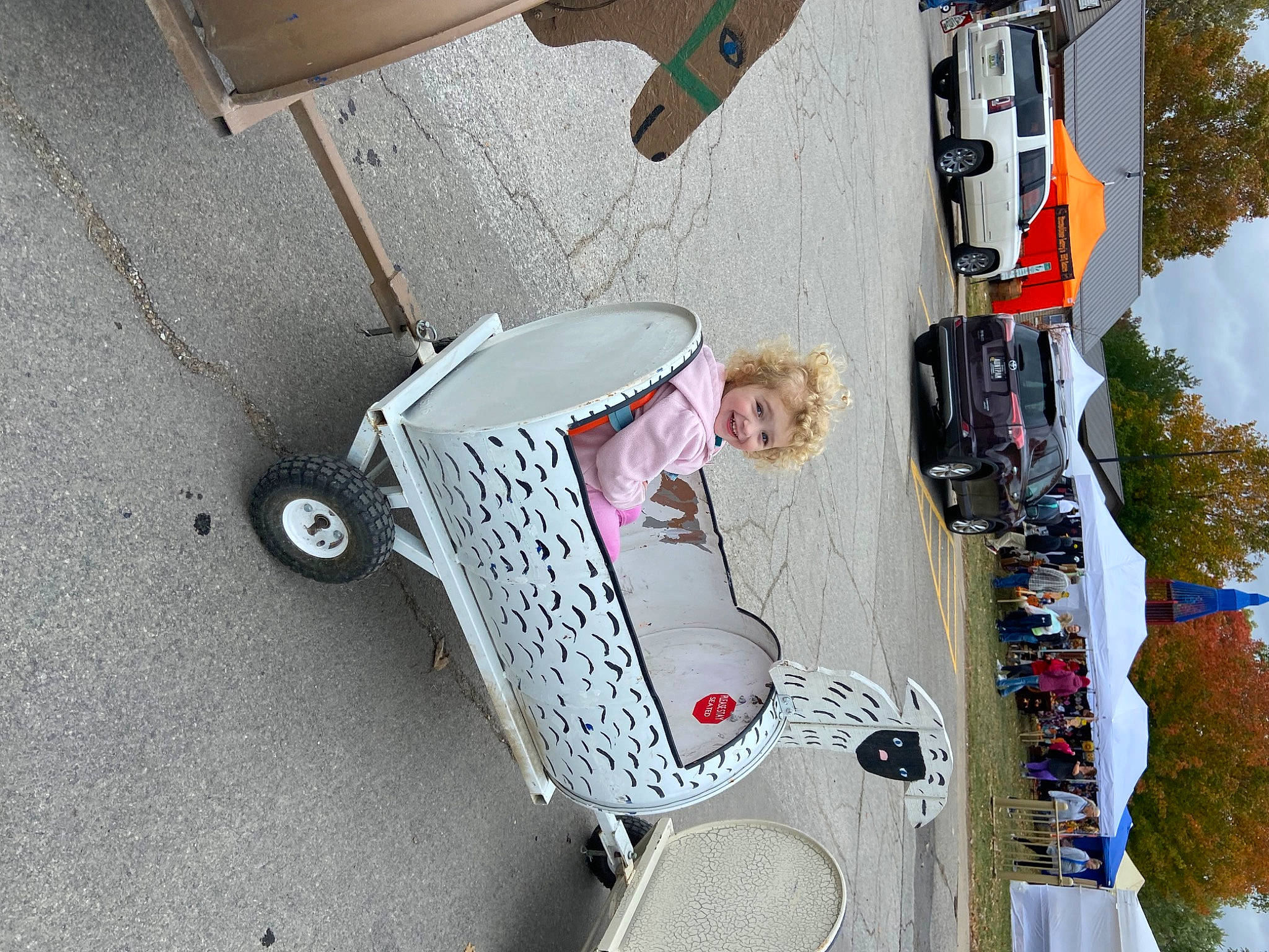 Allison joined the competition — help win amazing prizes! asphalt, auto_part, automotive_exterior, automotive_lighting, car, drum, joy, machine, motor_vehicle, musical_instrument, person, road, road_surface, sidewalk, sky, street, tire, tree, vehicle, vehicle_door