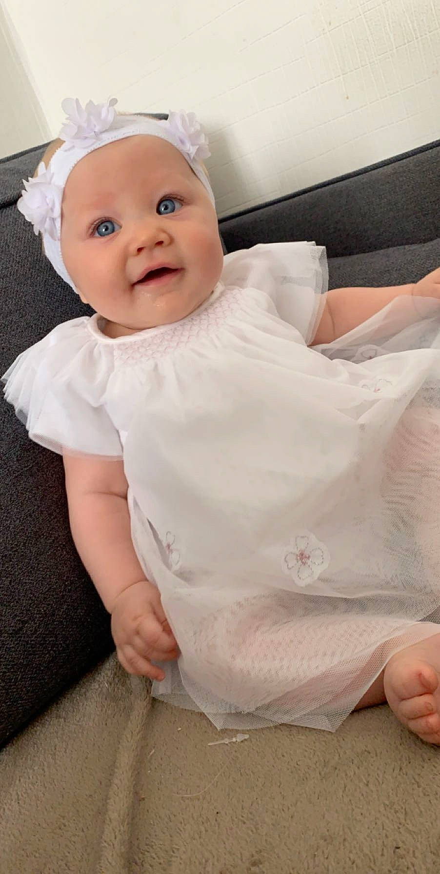 Keyla participe au concours pour gagner de l'argent avec cette photo : baby, baby_products, baby_toddler_clothing, cheek, child, dress, head, headgear, person, pink, product, skin, sleeve, toddler, white
