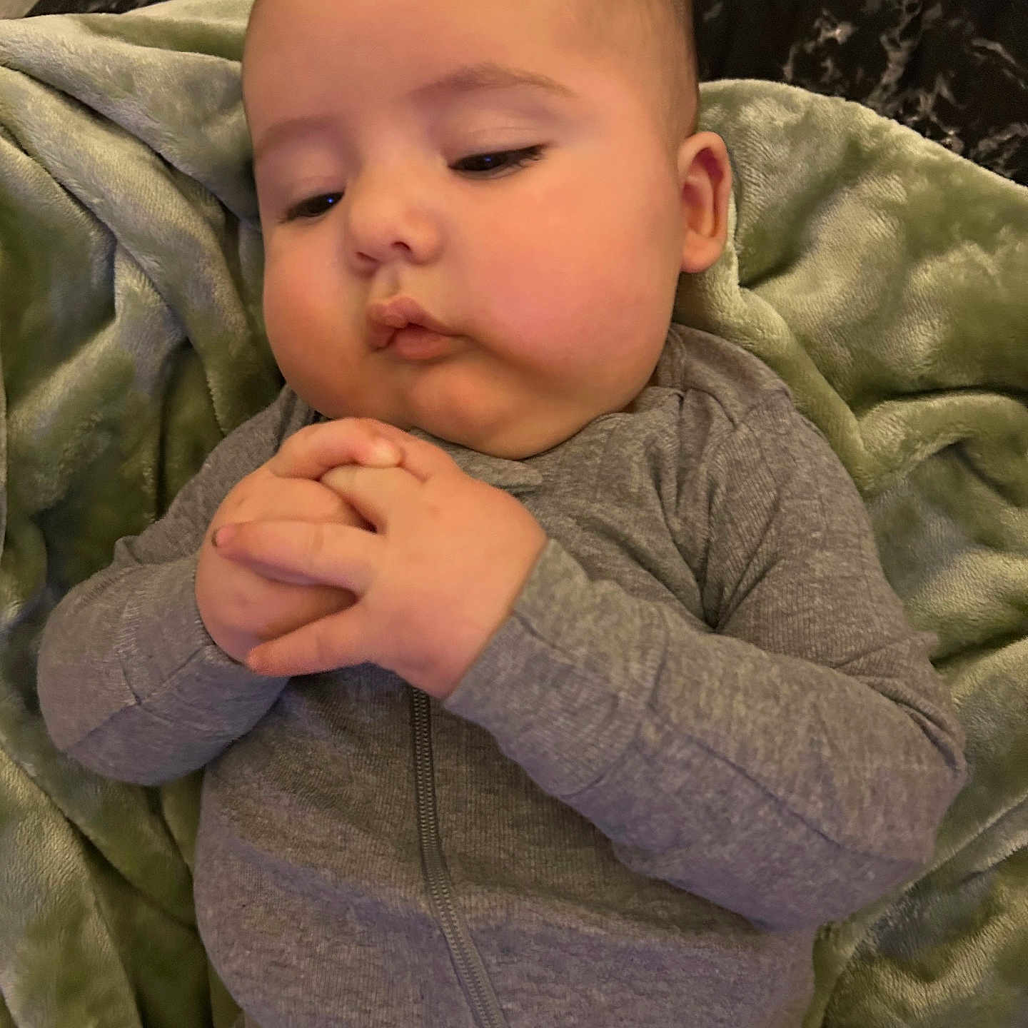 Wyatt is registered to the contest to win money with this photo: baby, blanket, bodypart, clothing, coat, cushion, face, finger, hand, head, homedecor, jacket, knitwear, newborn, people, person, photography, portrait, sleeping, sweater