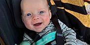 Greyson joined the competition — help win amazing prizes! baby, smiling, stroller, blue_eyes, striped_clothing, pacifier_clip, sunlight, shadow, infant, child, happy, seatbelt, fabric, hand, blanket, outdoor, closeup, portrait, person, cute