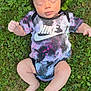 Shiloh is registered to the contest to win money with this photo: baby, infant, grass, outdoor, onesie, nike, clothing, sleeping, child, nature, greenery, legs, feet, arms, peaceful, portrait, skin, summer, casual, relaxation