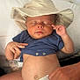 baby, sleeping, hat, blue_shirt, diaper, hand, pillow, infant, peaceful, indoors, skin, face, closed_eyes, lying_down, newborn, cute, relaxed, child, human, tender
