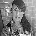 Laura E.