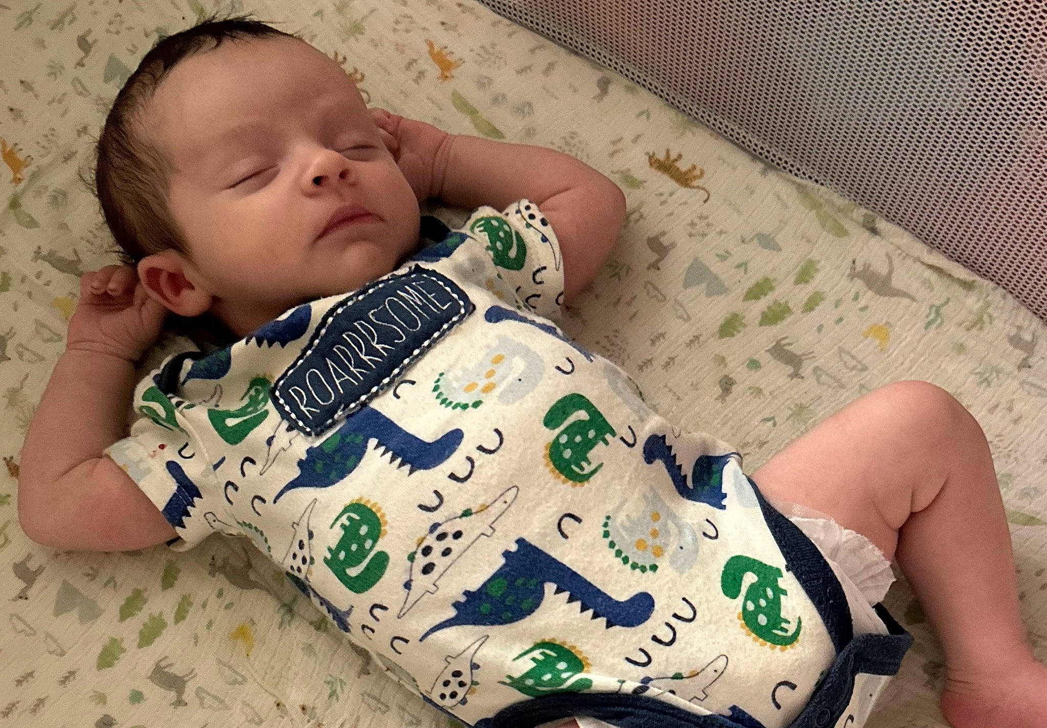 Jaxton is registered to the contest to win money with this photo: baby, baby_sleeping, baby_toddler_clothing, barefoot, cheek, child, comfort, cool, foot, grass, happy, human_leg, linens, pattern, person, sitting, skin, sleeve, textile, thigh