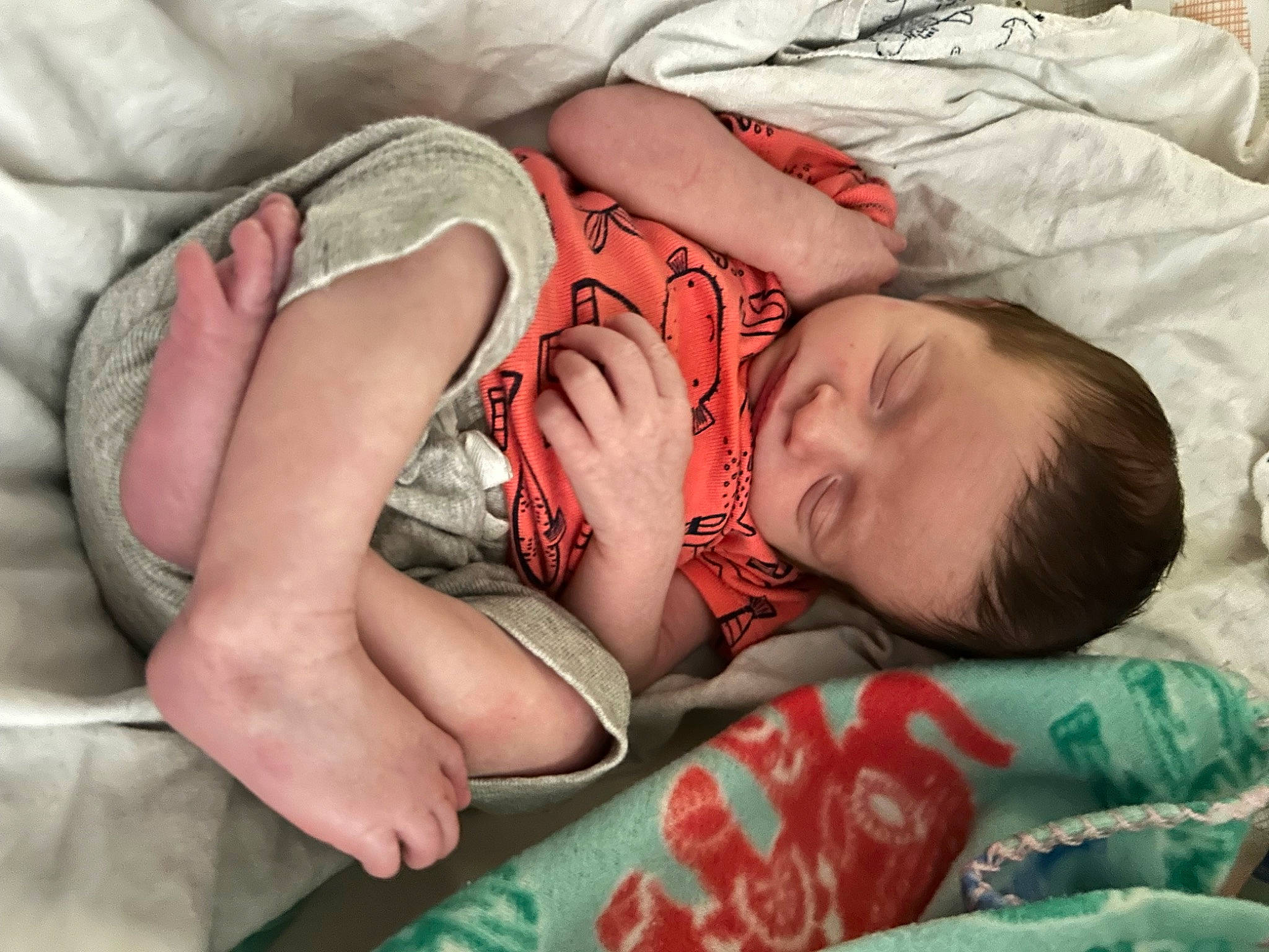 Jaxton is registered to the contest to win money with this photo: baby, baby_sleeping, baby_toddler_clothing, bedding, bedtime, child, comfort, grass, human, linens, mammal, nap, pattern, person, room, sitting, skin, sleep, textile, thigh
