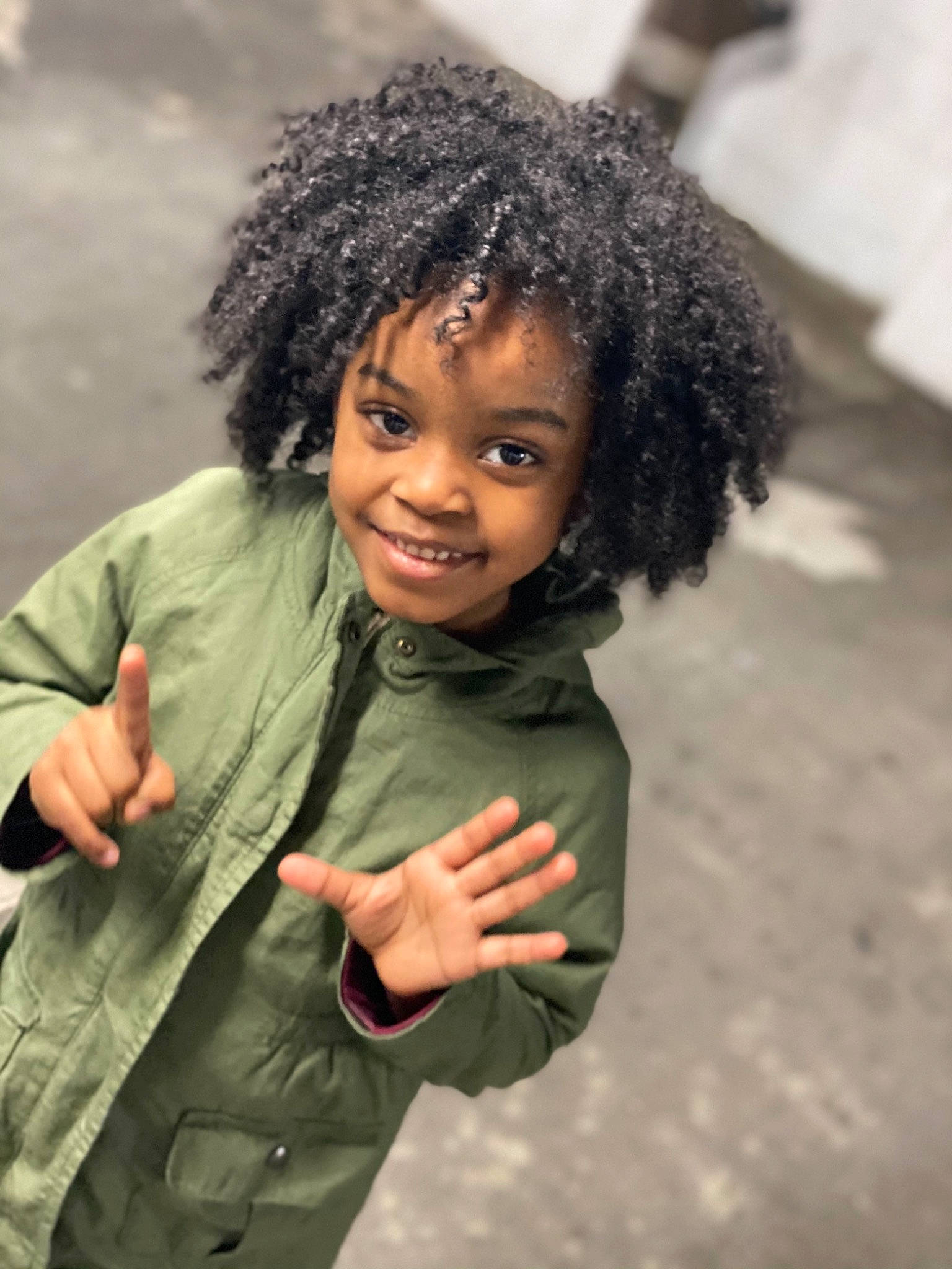 Denim is registered to the contest to win money with this photo: afro, arm, black_hair, cheek, child, eye, face, flash_photography, forehead, gesture, happy, human_body, jheri_curl, joy, lip, nose, outerwear, person, skin, sleeve