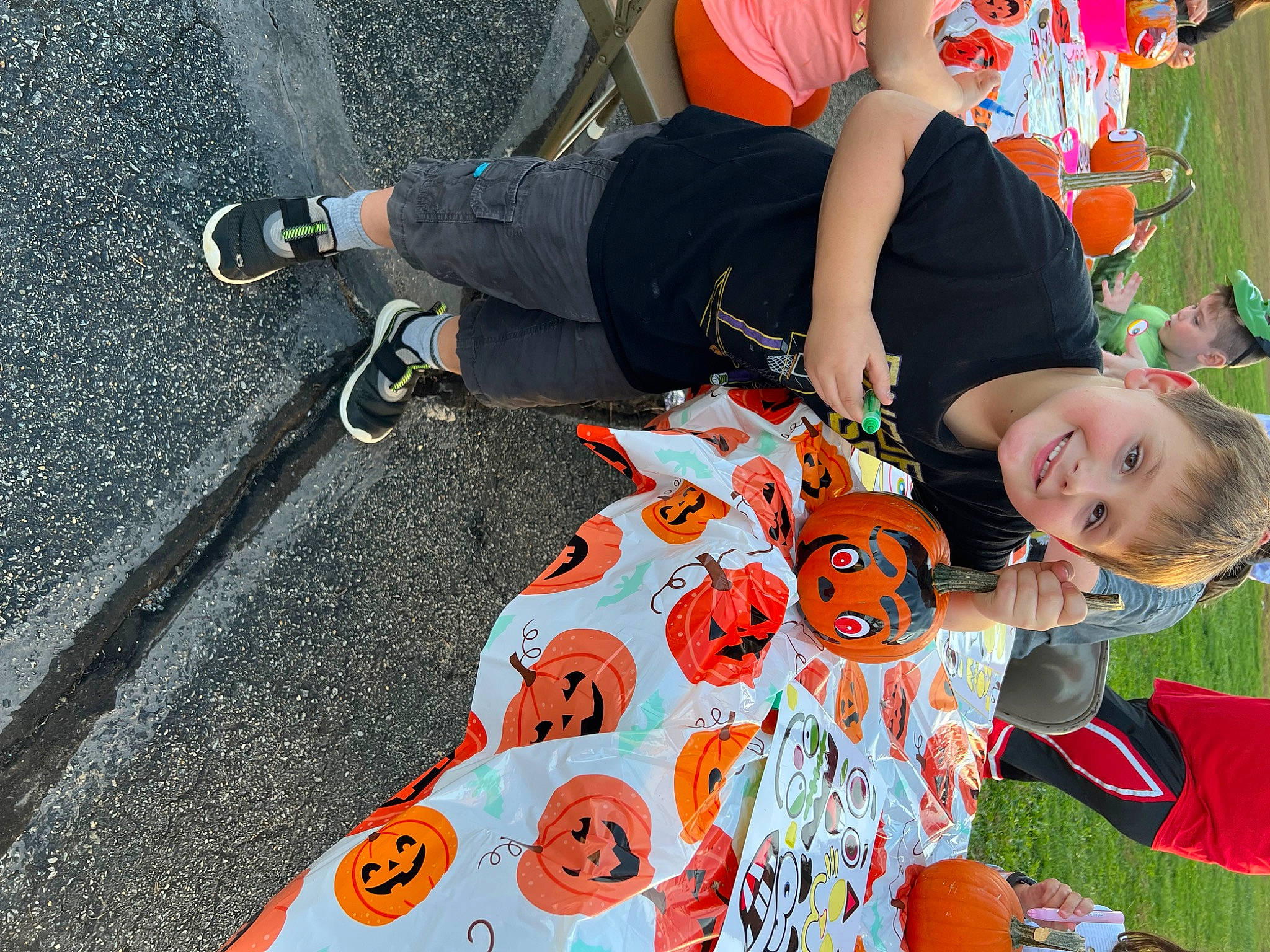 Gage joined the competition — help win amazing prizes! asphalt, child, event, fun, grass, happy, head, human_leg, joy, knee, leisure, luggage_and_bags, orange, pattern, people_in_nature, person, recreation, sitting, smile, t_shirt