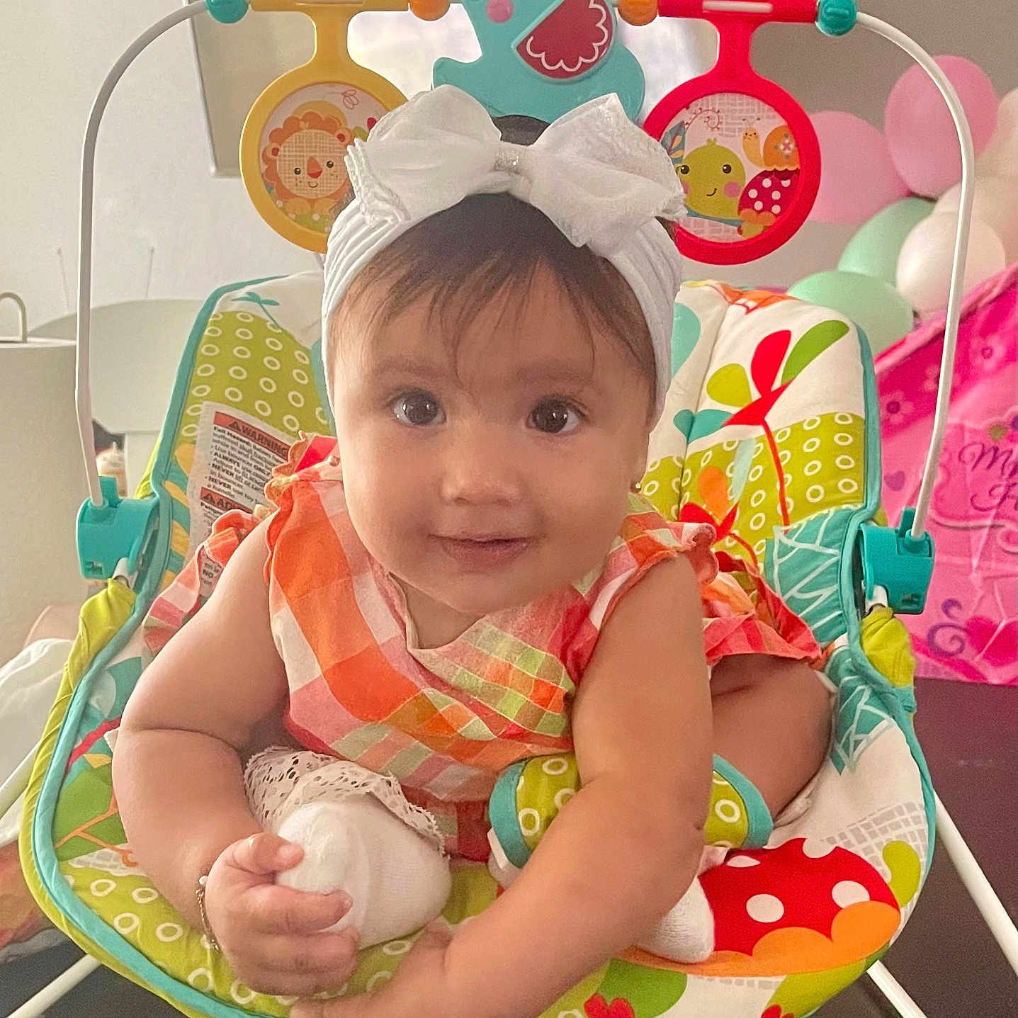 Hanna joined the competition — help win amazing prizes! americanfootball, americanfootballball, baby, ball, balloon, clothing, face, football, furniture, happy, hat, head, newborn, people, person, photography, portrait, sitting, smile, sport