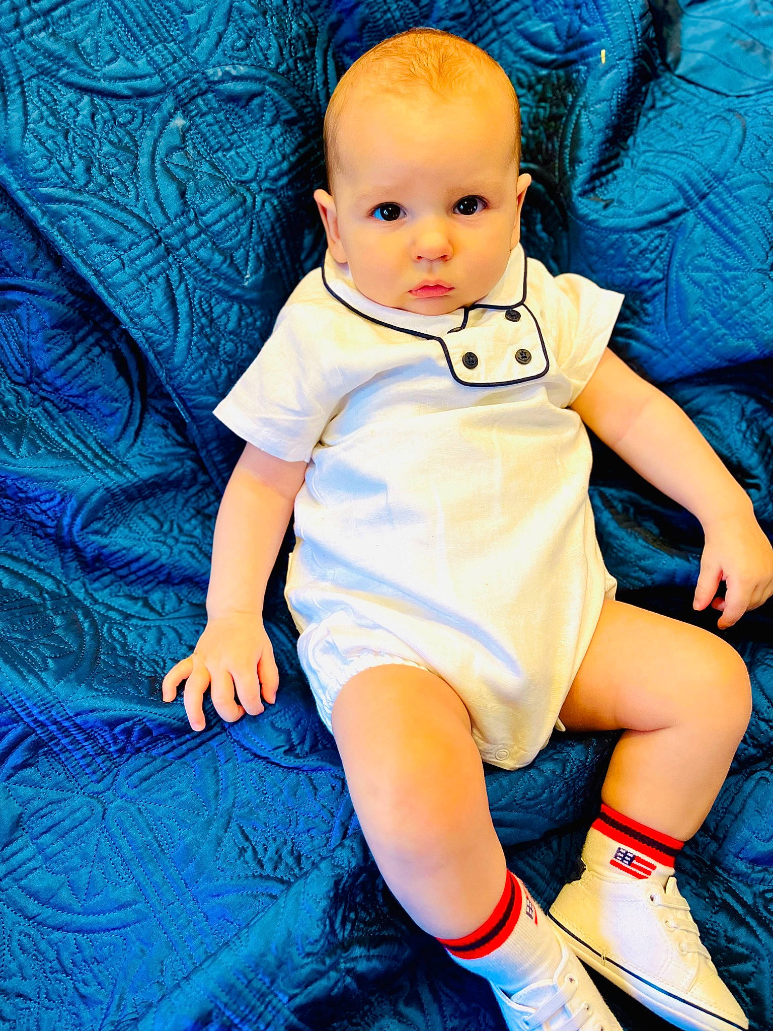 Nicholas is registered to the contest to win money with this photo: aqua, azure, baby, baby_toddler_clothing, blue, child, day_dress, electric_blue, flash_photography, fun, happy, human_leg, pattern, people_in_nature, person, pink, play, portrait_photography, sitting, thigh