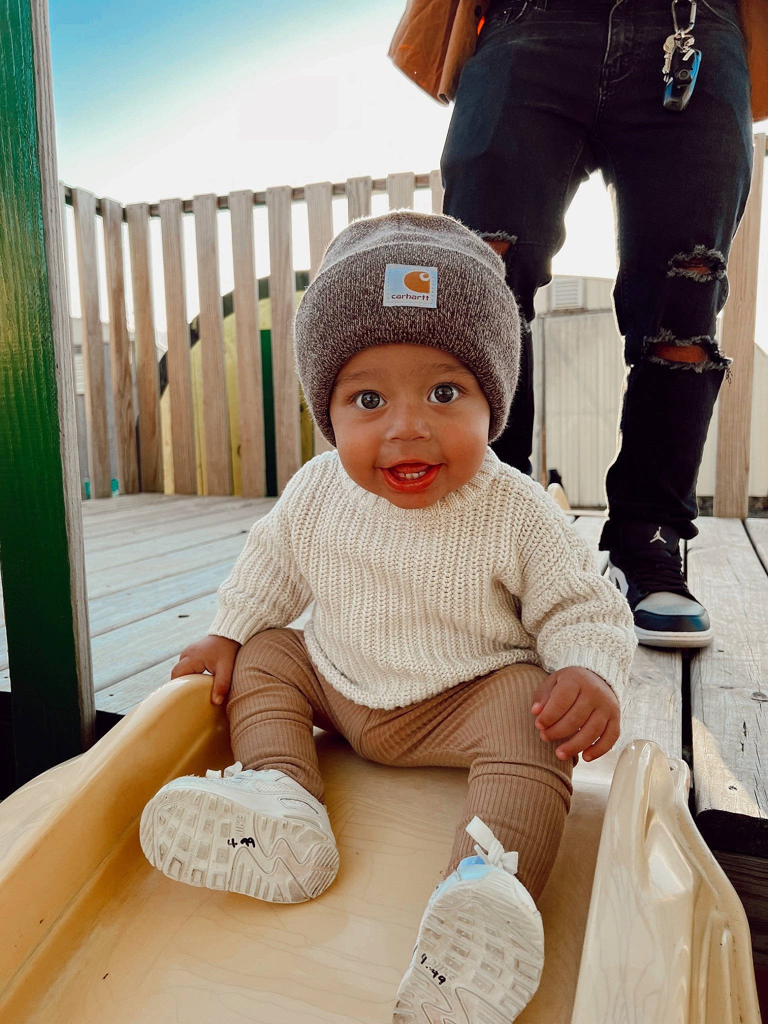Kayvon is registered to the contest to win money with this photo: baby, baby_toddler_clothing, cap, child, comfort, fun, happy, hat, headgear, headwear, knit_cap, leisure, outerwear, person, photograph, product, sky, sleeve, smile, textile