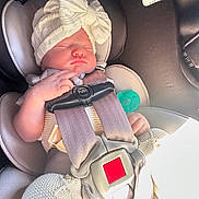 Hannah joined the competition — help win amazing prizes! baby, car_seat, knit_hat, sleeping, infant, child, seatbelt, knitwear, hand, cute, peaceful, indoors, car, safety, headwear, child_seat, pacifier, soft_lighting, closeup, portrait