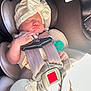 baby, car_seat, knit_hat, sleeping, infant, child, seatbelt, knitwear, hand, cute, peaceful, indoors, car, safety, headwear, child_seat, pacifier, soft_lighting, closeup, portrait