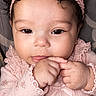 baby, infant, girl, headband, pink_clothing, curly_hair, closeup, portrait, cute, adorable, hand, face, soft_lighting, indoor, young_child, expression, looking_at_camera, skin, child, clothing