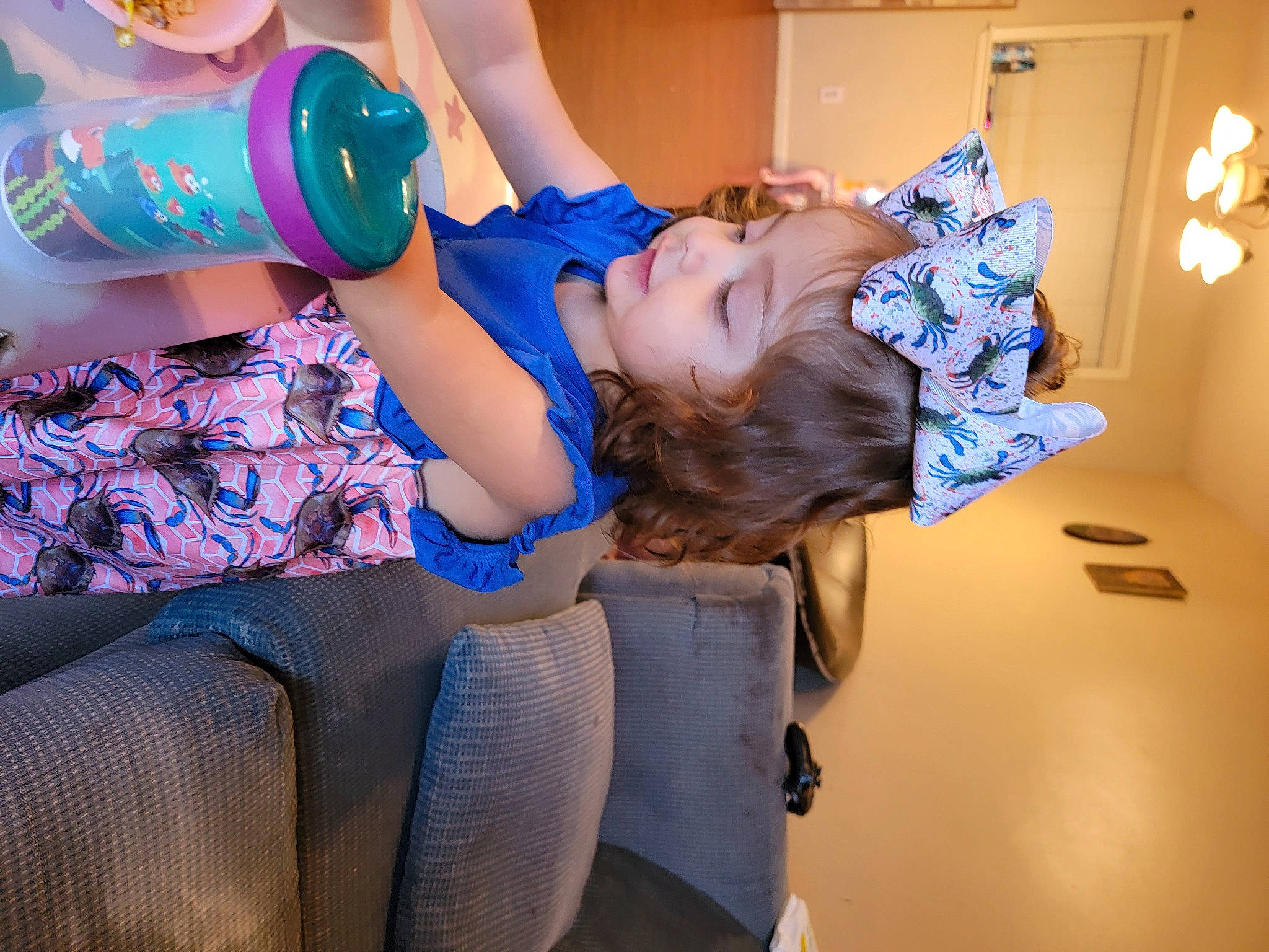 Josephine joined the competition — help win amazing prizes! abdomen, child, comfort, drinking, drinkware, elbow, electric_blue, event, finger, fun, happy, human_leg, knee, leisure, nail, person, plastic_bottle, purple, thigh, trunk