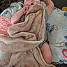 Isla is registered to the contest to win money with this photo: baby, blanket, sleeping, child, infant, cushion, pacifier, soft_texture, comfort, indoor, clothing, toddler, face, hand, foot, toy, nap, portrait, cozy, rest