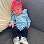 baby, denim_jacket, pink_bow, headband, baby_shoes, black_leggings, couch, gray_couch, infant, child, indoor, portrait, cute, small_child, sitting, clothing, footwear, face, person, casual
