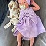 Ambre a rejoint le concours — aidez-le/la à gagner de superbes lots ! baby, infant, pacifier, purple_dress, headband, striped_clothing, teddy_bear_toy, blanket, soft_toy, lying_down, curious_expression, indoor, person, child, cute, small_feet, fabric, comfort, bed, portrait