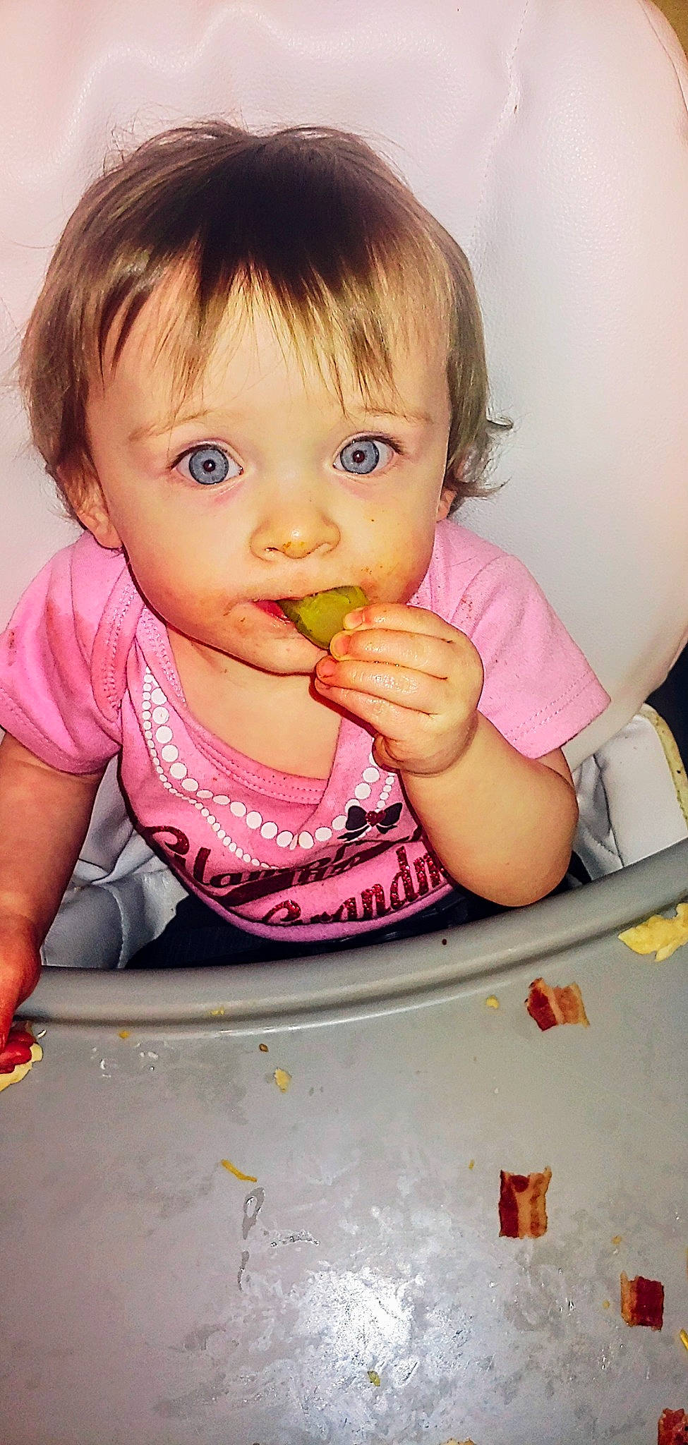 Rhea is registered to the contest to win money with this photo: baby, baby_grabbing_for_something, baby_playing_with_food, baby_toddler_clothing, biting, cheek, cuisine, eyelash, finger, food, food_craving, fun, happy, lip, nail, nose, person, pink, skin, sweetness