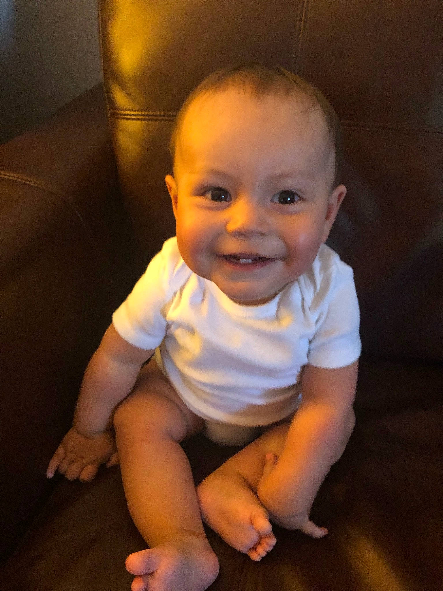 Cesar is registered to the contest to win money with this photo: baby, cheek, child, chin, eye, face, facial_expression, fun, head, iris, joy, leg, lip, mouth, nose, person, sitting, skin, smile, standing