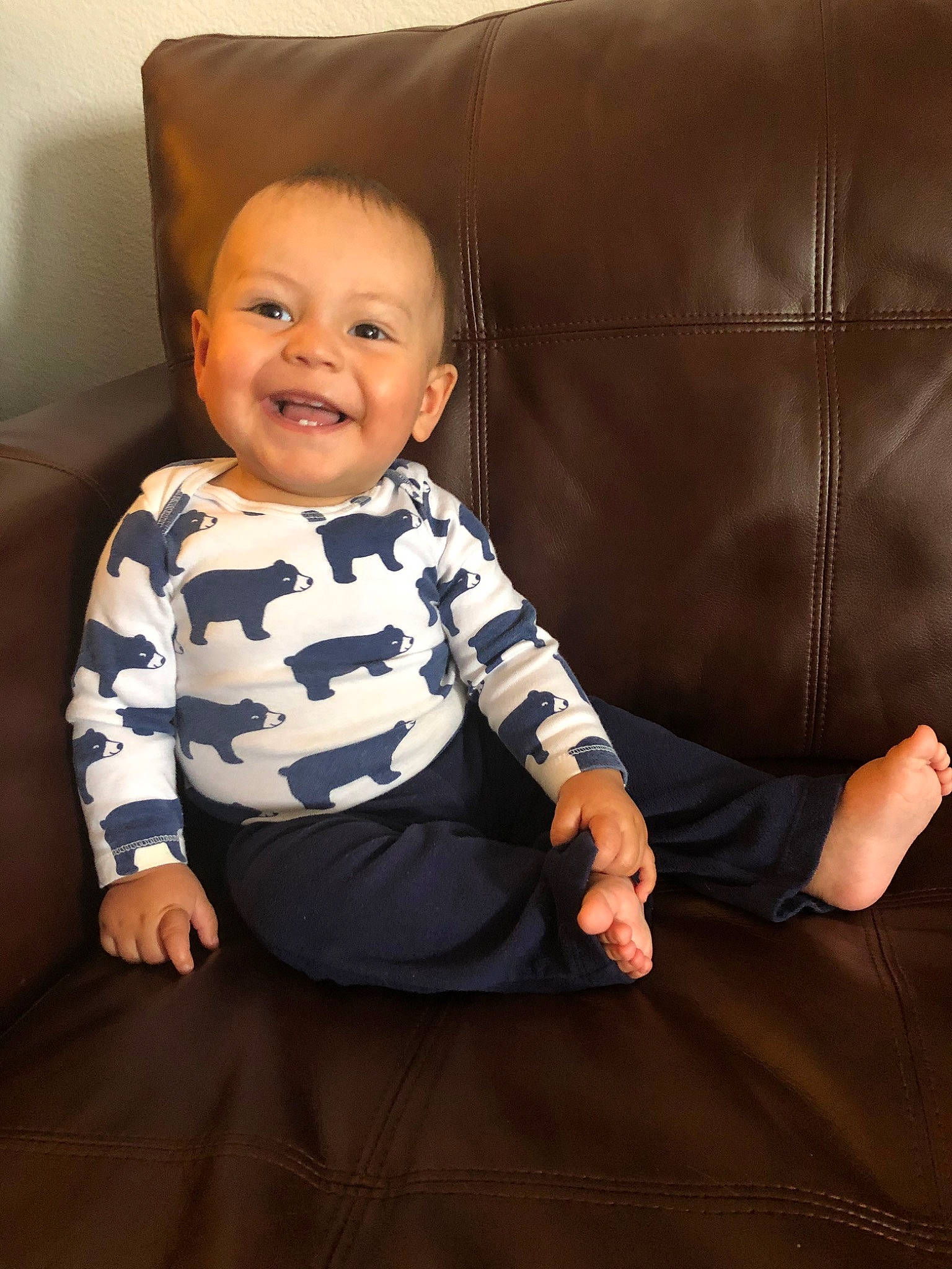 Cesar is registered to the contest to win money with this photo: baby, cheek, child, face, facial_expression, family, furniture, head, joy, person, sitting, skin, sleeve, smile, toddler