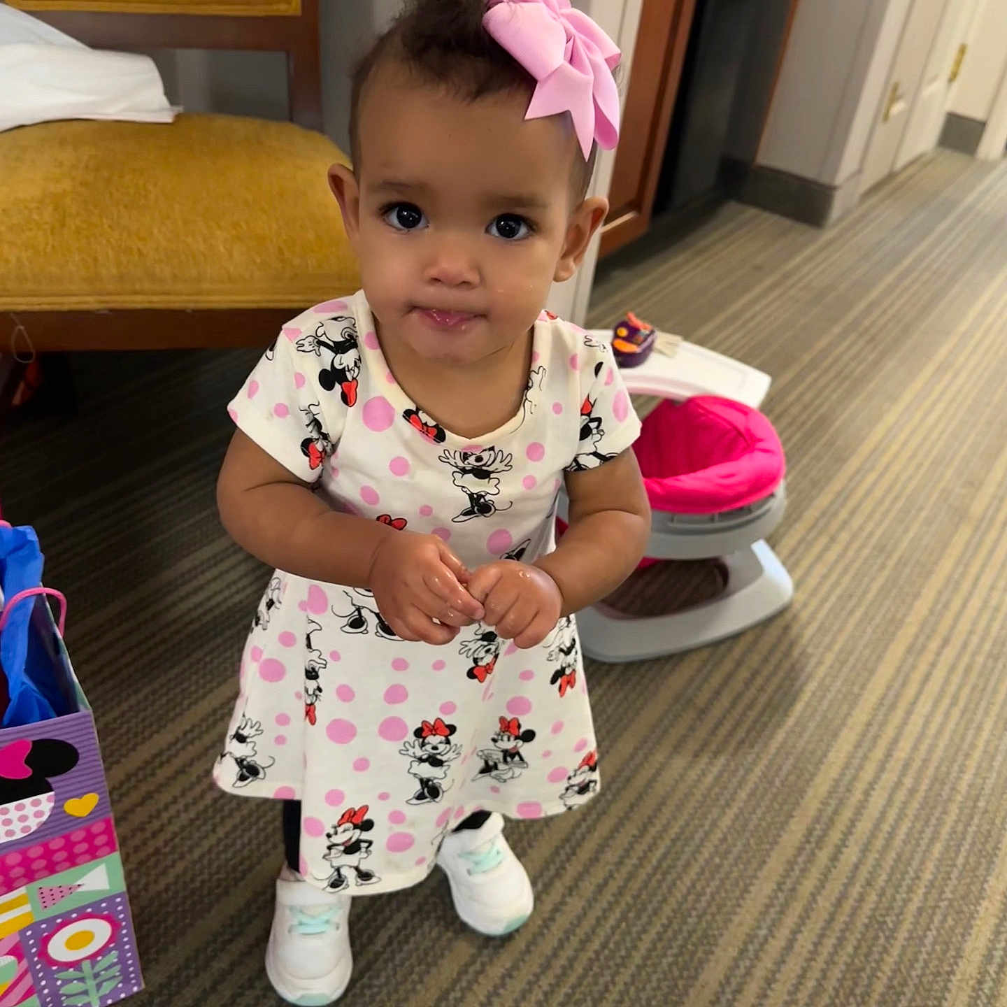 Myla is registered to the contest to win money with this photo: baby, bathroom, clothing, door, dress, face, footwear, furniture, hat, head, indoors, interiordesign, pants, person, photography, portrait, room, shoe, sitting, toilet