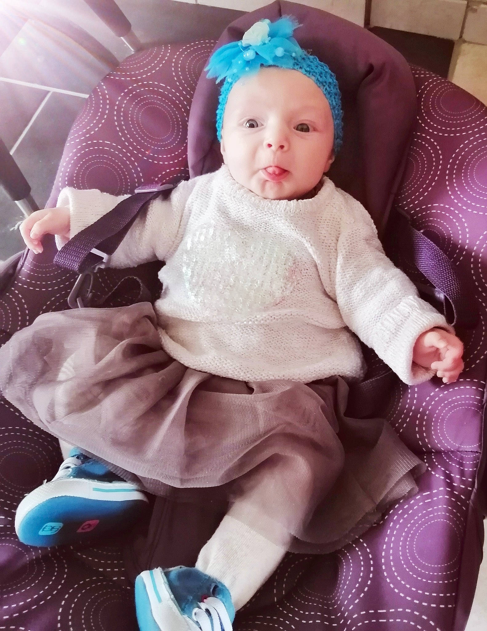 Celestine participe au concours pour gagner de l'argent avec cette photo : baby, baby_toddler_clothing, blue, cheek, child, comfort, eye, head, headwear, iris, lap, magenta, person, pink, product, purple, shoe, skin, sleeve, toddler