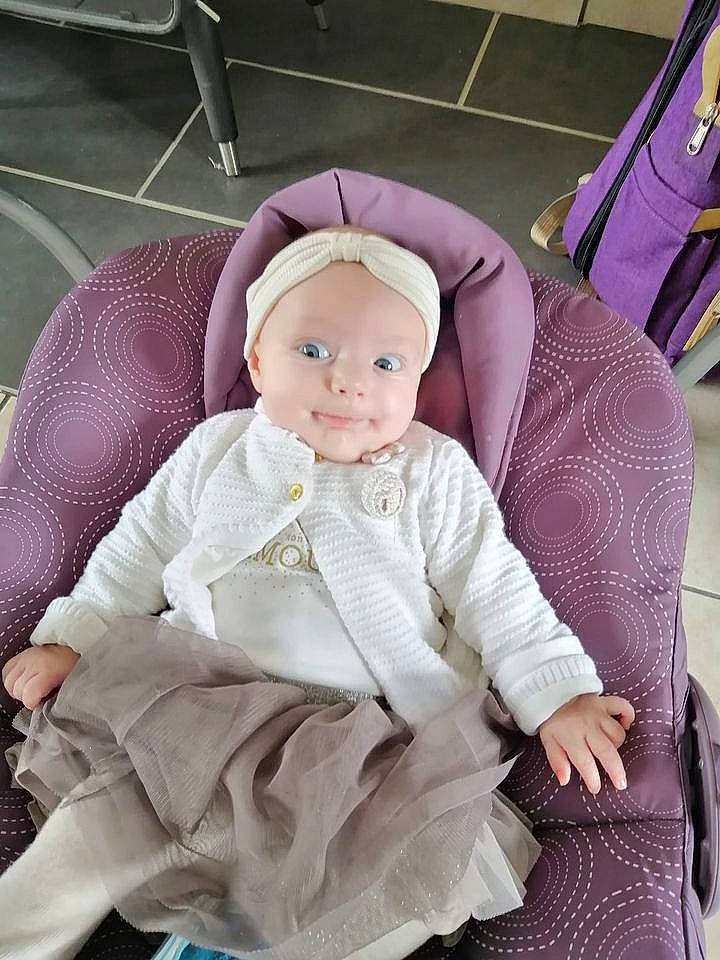 Celestine a rejoint le concours — aidez-le/la à gagner de superbes lots ! baby, baby_products, baby_toddler_clothing, child, costume, costume_hat, doll, fashion_accessory, headgear, headwear, magenta, person, pink, plush, purple, sitting, sleeve, smile, stuffed_toy, toddler