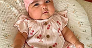 Aria joined the competition — help win amazing prizes! baby, infant, pink_bow, headband, cherry_pattern, cute, clothing, cushion, floral, quilted, indoors, wood_floor, expression, face, skin, arm, legs, sitting, child, portrait