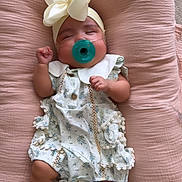 Aria joined the competition — help win amazing prizes! baby, infant, pacifier, headband, bow, floral_dress, pink_cushion, sleeping, medical_sensor, ankle_band, soft_texture, cute, resting, indoors, child, newborn, comfort, peaceful, small_hands, tiny_feet