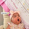 baby, child, yawning, pink_bow, headband, floral_dress, oxygen_tube, chair, blanket, embroidery, name, cute, sleepy, indoors, infant, person, text_overlay, decor, soft_lighting, portrait