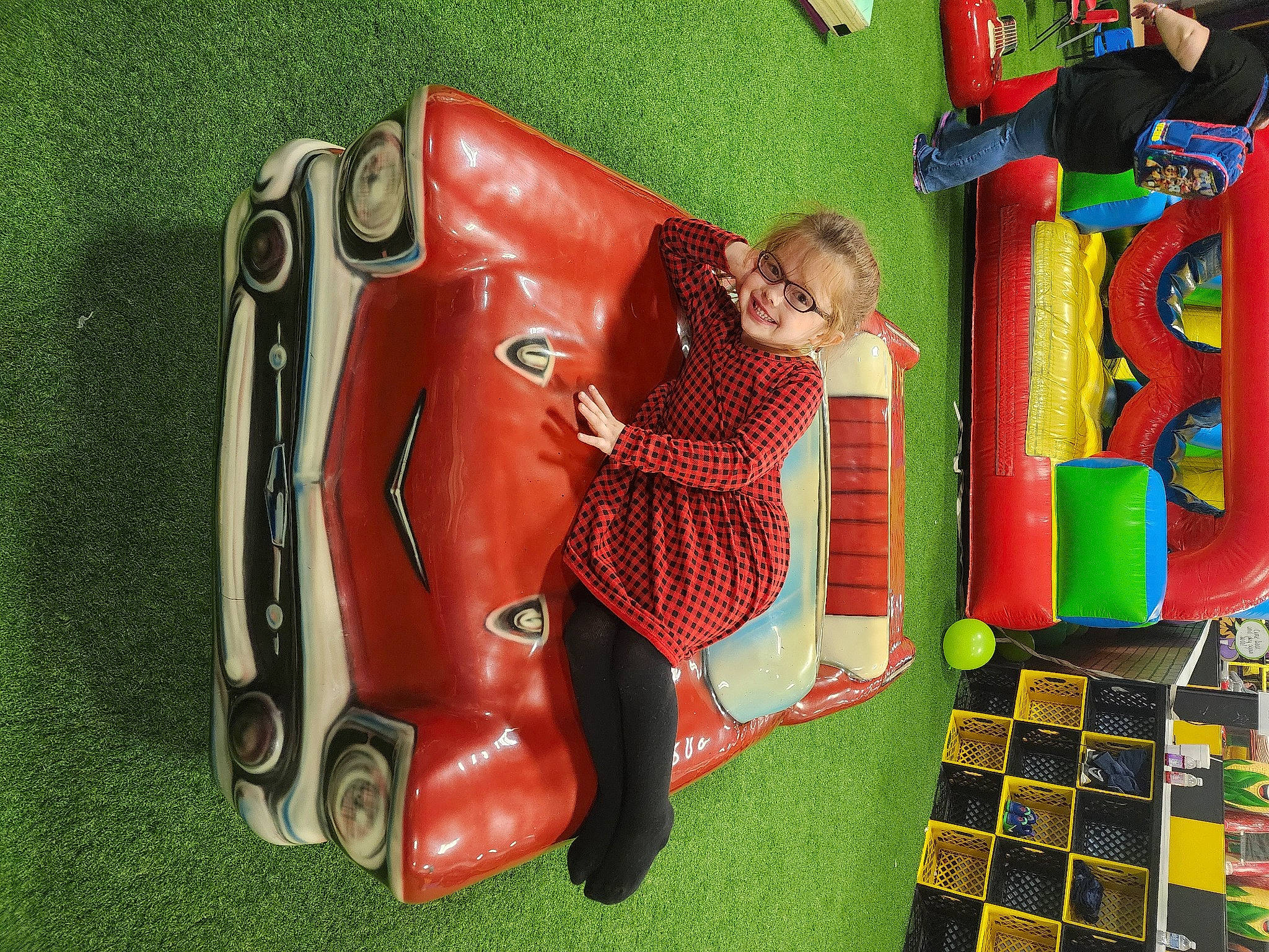 Meghan is registered to the contest to win money with this photo: art, carpet, city, classic, classic_car, flooring, fun, grass, joy, leisure, motor_vehicle, outdoor_play_equipment, pattern, person, play, playground, product, recreation, room, textile