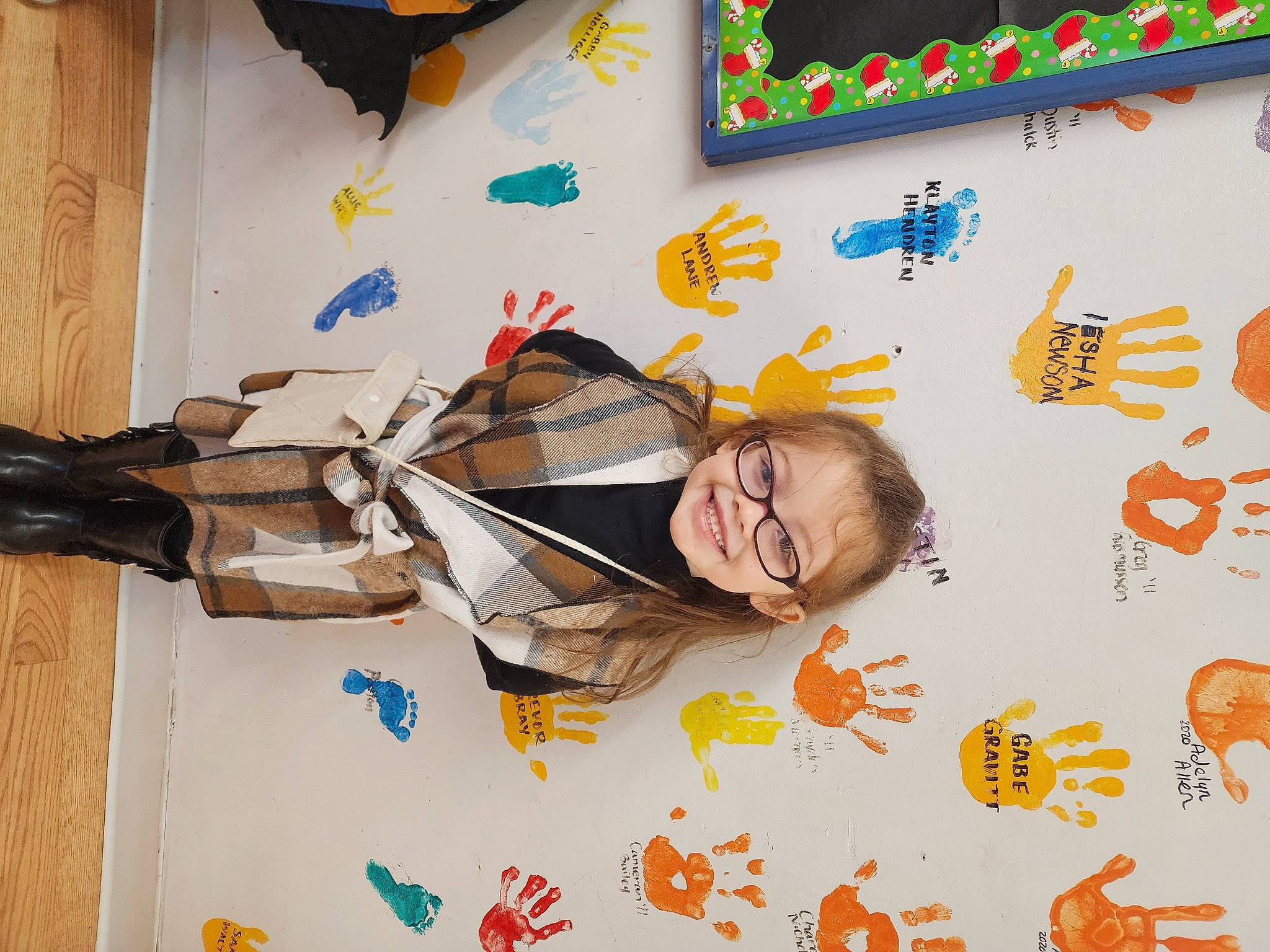 Meghan is registered to the contest to win money with this photo: art, child, eyewear, flooring, font, fun, happy, joy, leisure, person, play, room, smile, toddler, visual_arts, wood