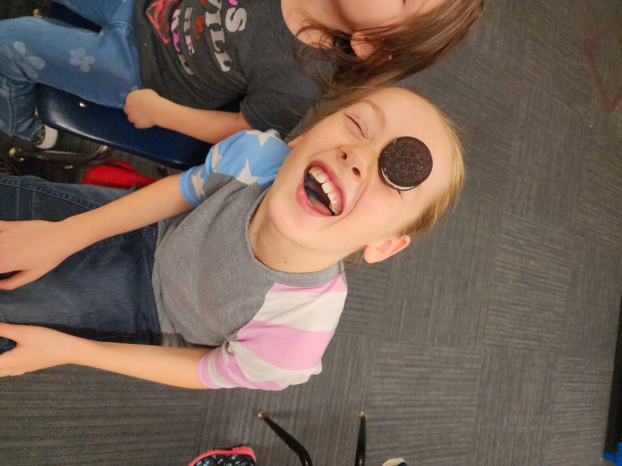 Ryleigh is registered to the contest to win money with this photo: chest, child, cool, elbow, eyelash, eyewear, finger, fun, gesture, hand, happy, laugh, mouth, nail, person, sleeve, smile, t_shirt, thigh, thumb