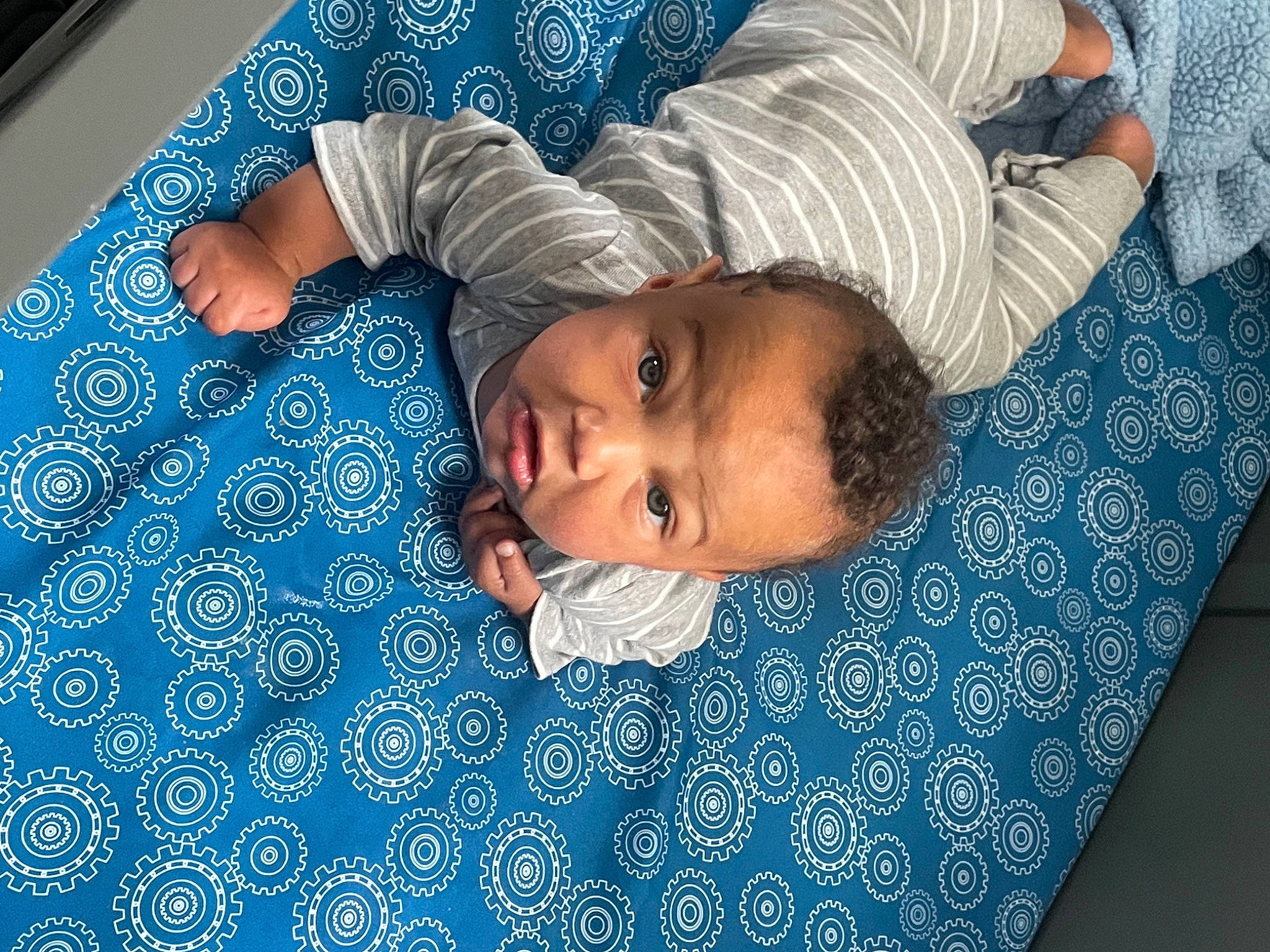 Korbyn joined the competition — help win amazing prizes! azure, baby, baby_toddler_clothing, bedtime, blue, child, comfort, electric_blue, eye, flooring, fun, happy, head, leisure, linens, pattern, person, room, textile, toddler