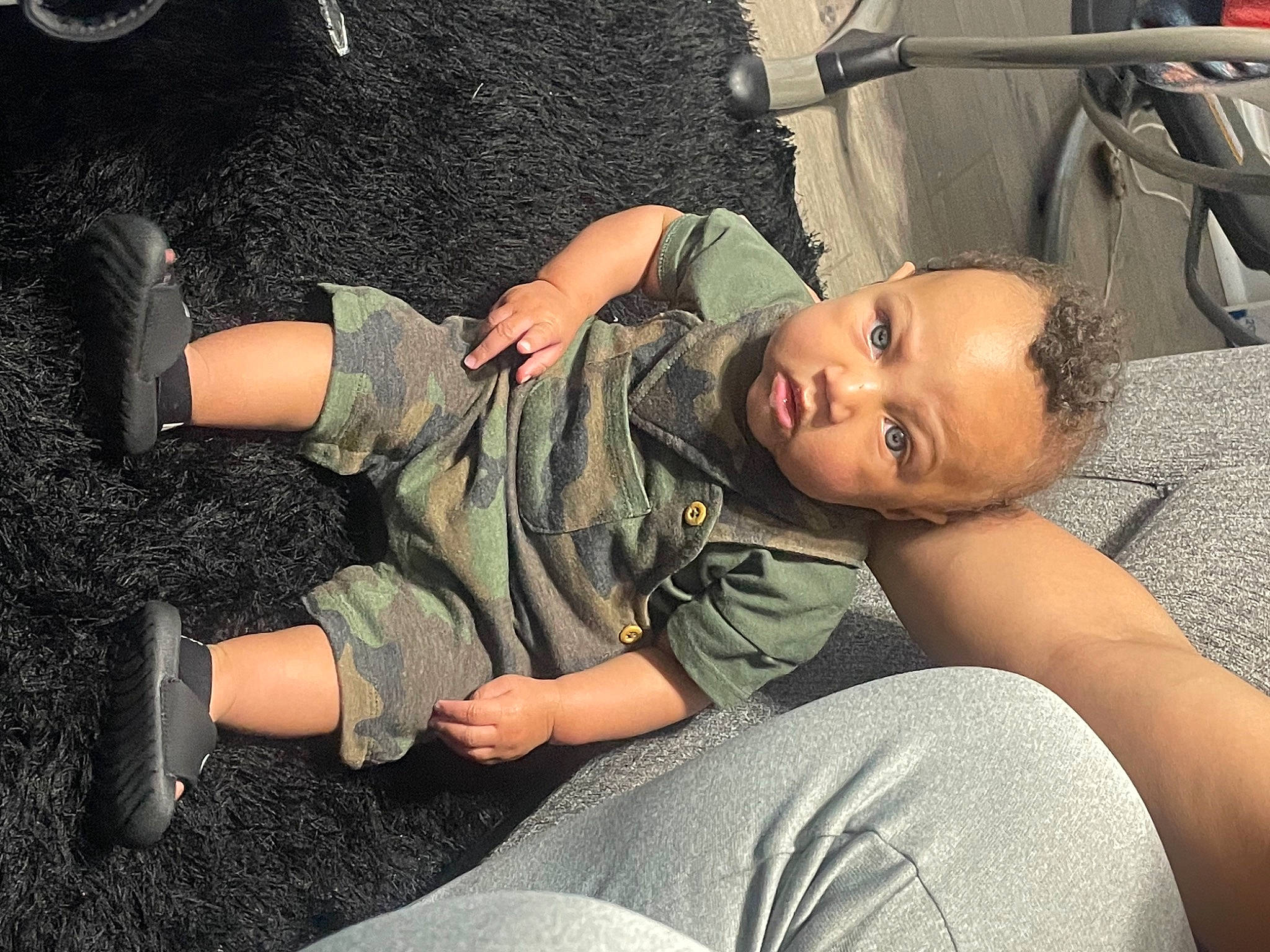 Korbyn is registered to the contest to win money with this photo: arm, chair, comfort, cool, couch, elbow, flash_photography, fun, gesture, grass, hairstyle, hand, human_leg, joint, knee, leg, military_camouflage, person, shoulder, sitting