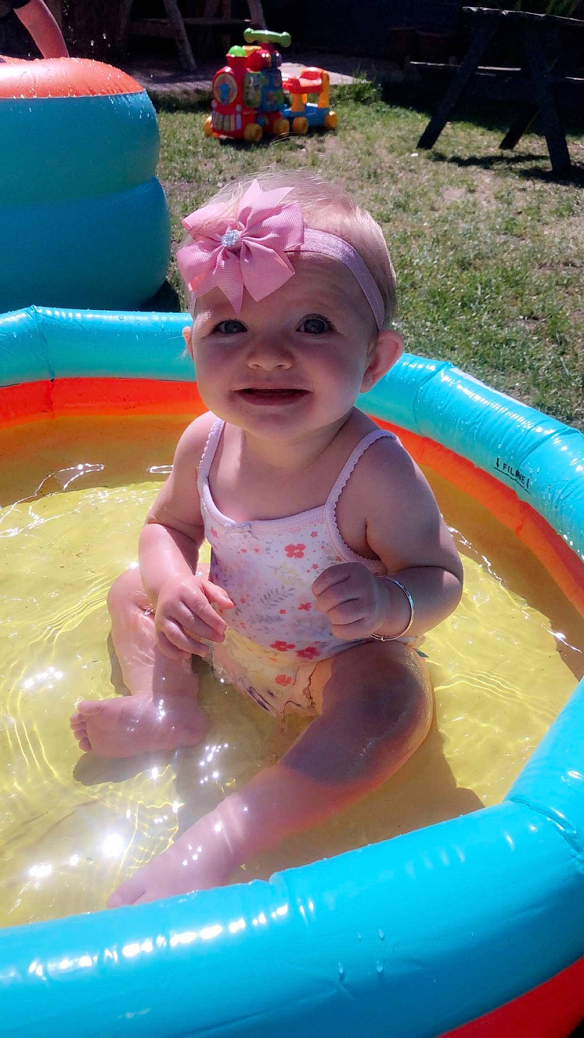 Isla-grace is registered to the contest to win money with this photo: baby_float, baby_products, bathing, child, fun, games, headwear, inflatable, leisure, person, play, product, recreation, summer, swimming_pool, toddler, water