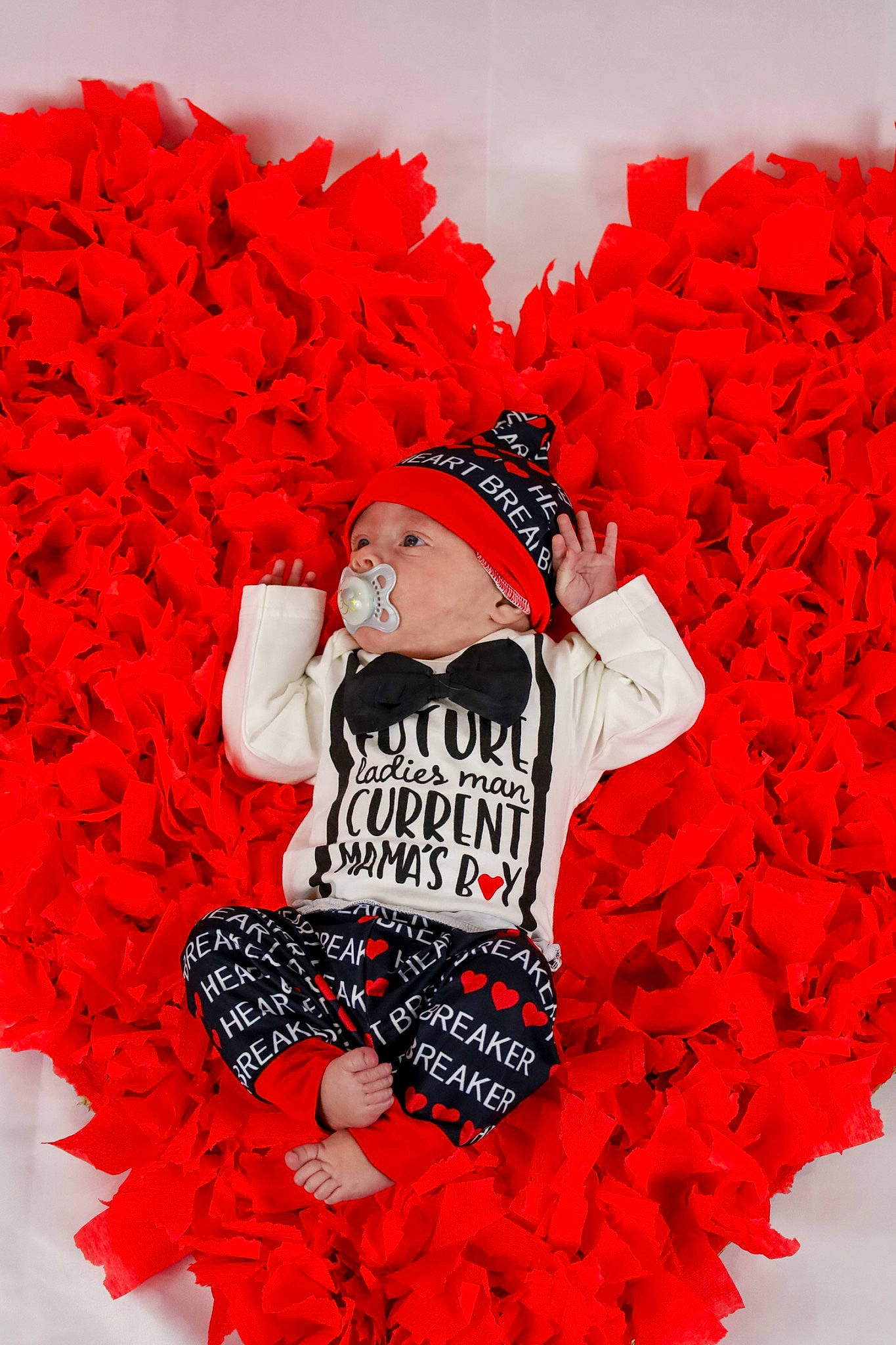 Westin is registered to the contest to win money with this photo: baby_toddler_clothing, carmine, cut_flowers, event, fashion, fictional_character, flower, font, graphics, happy, headgear, headwear, magenta, orange, person, petal, pink, product, red, sleeve