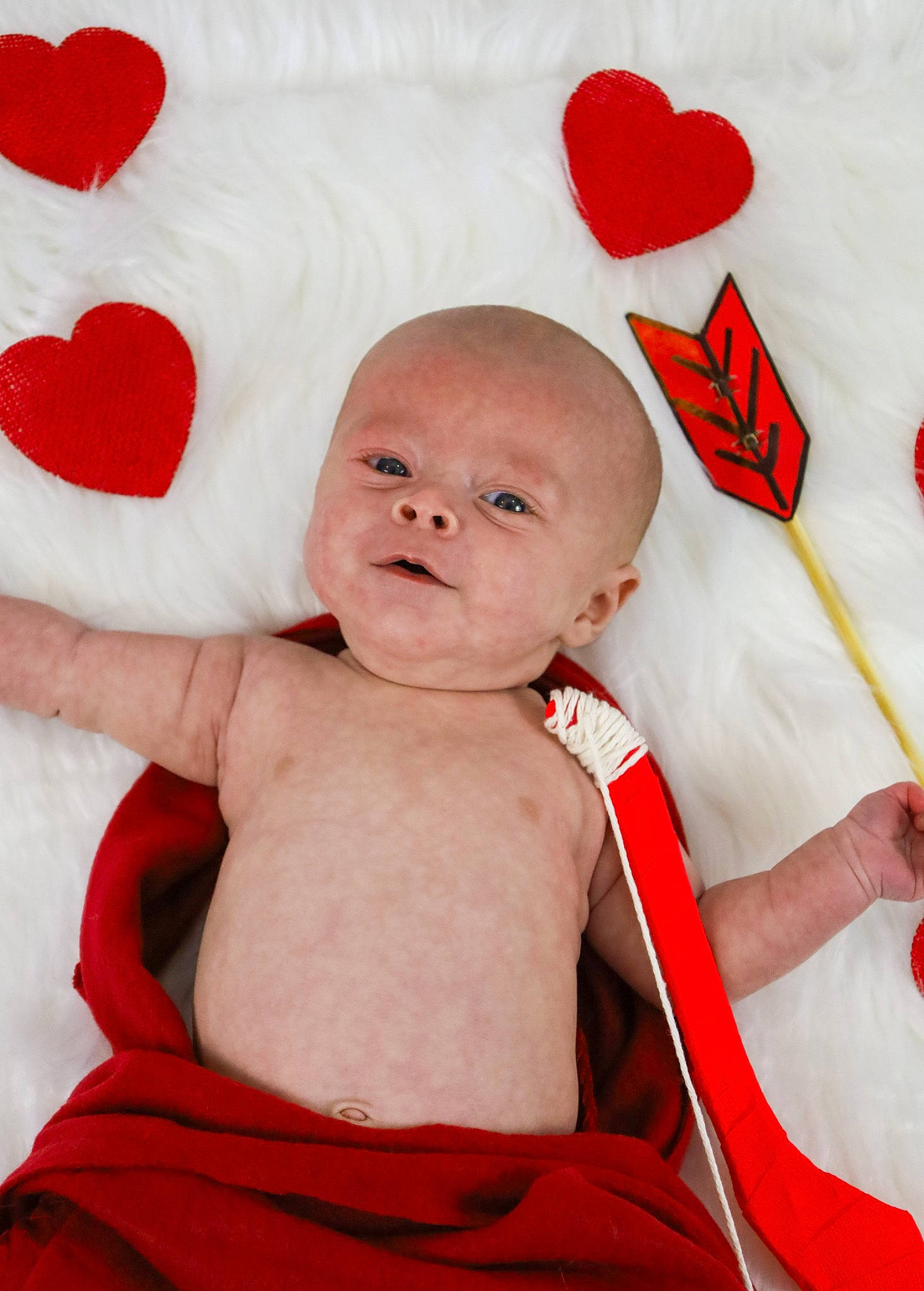 Westin is registered to the contest to win money with this photo: baby, baby_toddler_clothing, carmine, cheek, child, comfort, event, facial_expression, gesture, happy, holiday, linens, orange, organ, person, pink, red, skin, smile, stomach