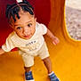 toddler, child, playground, yellow, red, tunnel, braids, hair, curious, outdoor, shoes, shorts, tshirt, smiling, happy, person, play, fun, young, cute