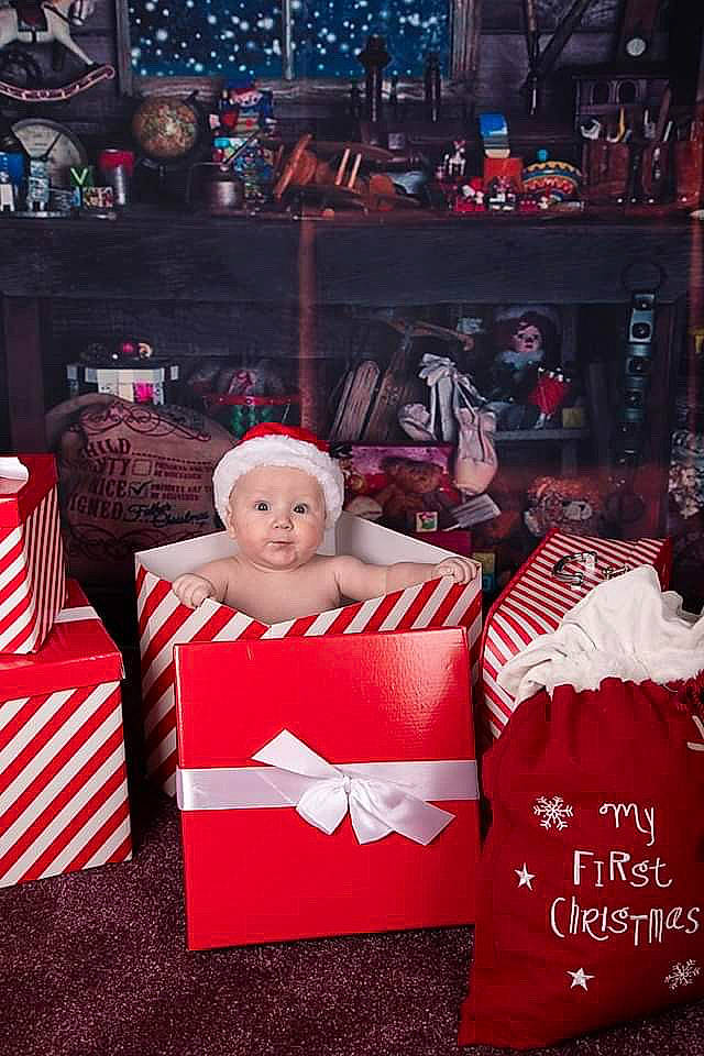 Brett joined the competition — help win amazing prizes! chair, christmas, christmas_eve, event, fictional_character, furniture, gift_wrapping, holiday, person, present, red, room