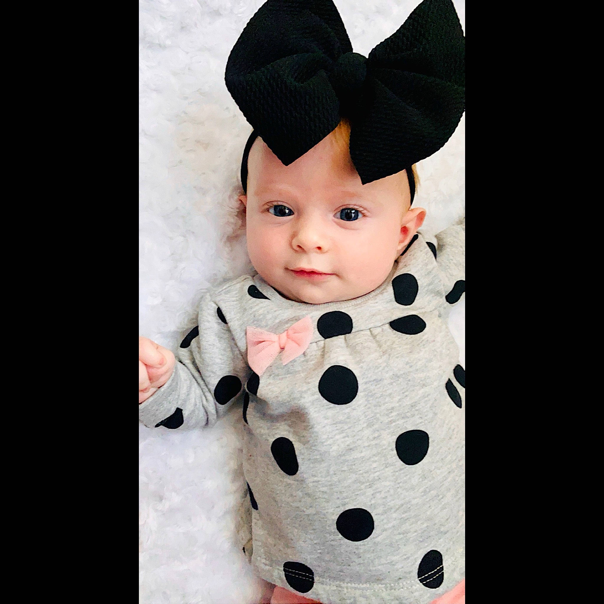Sally is registered to the contest to win money with this photo: baby, baby_products, baby_toddler_clothing, black_hair, child, clothing, costume, costume_accessory, costume_hat, design, ear, head, headgear, outerwear, pattern, person, polka_dot, product, sleeve, toddler