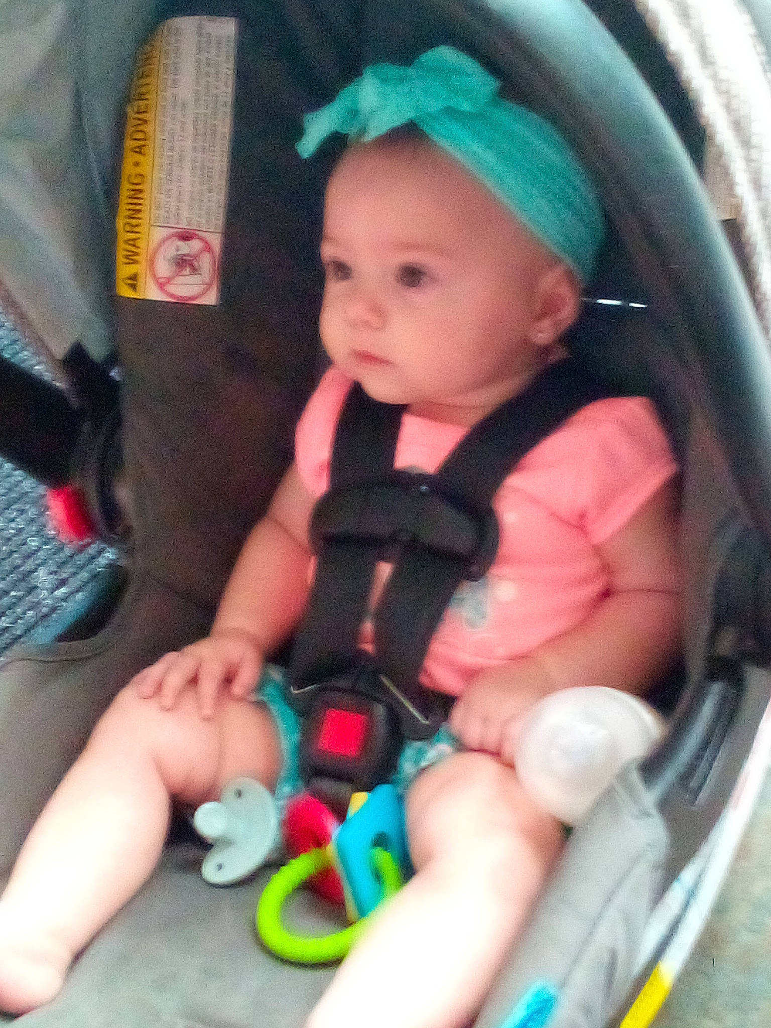 Rilynn joined the competition — help win amazing prizes! baby, baby_carriage, baby_products, baby_safety, baby_toddler_clothing, car_seat, cheek, child, comfort, finger, green, iris, lap, nail, person, pink, sitting, skin, snapshot, thumb