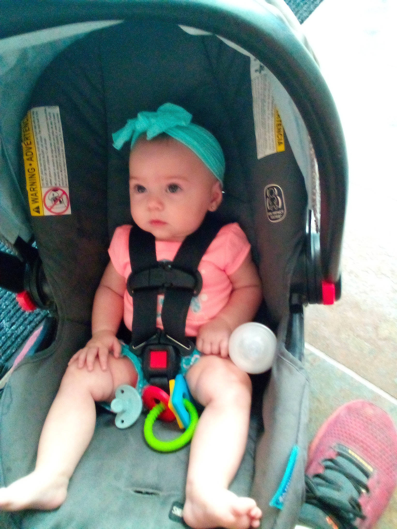 Rilynn is registered to the contest to win money with this photo: auto_part, baby, baby_carriage, baby_products, baby_safety, baby_toddler_clothing, car_seat, child, comfort, fun, lap, leisure, person, shoe, sitting, sneakers, thigh, toddler, travel, vacation