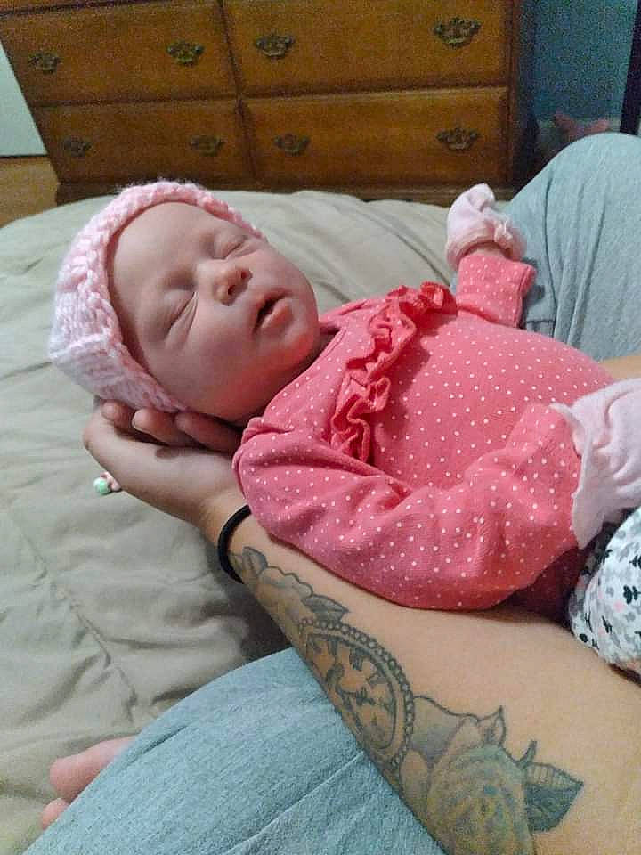 Aaliyah is registered to the contest to win money with this photo: baby, baby_sleeping, baby_toddler_clothing, bedding, bedtime, cabinetry, chest_of_drawers, child, comfort, flesh, head, human_leg, linens, magenta, pattern, person, room, sitting, sleeve, toddler