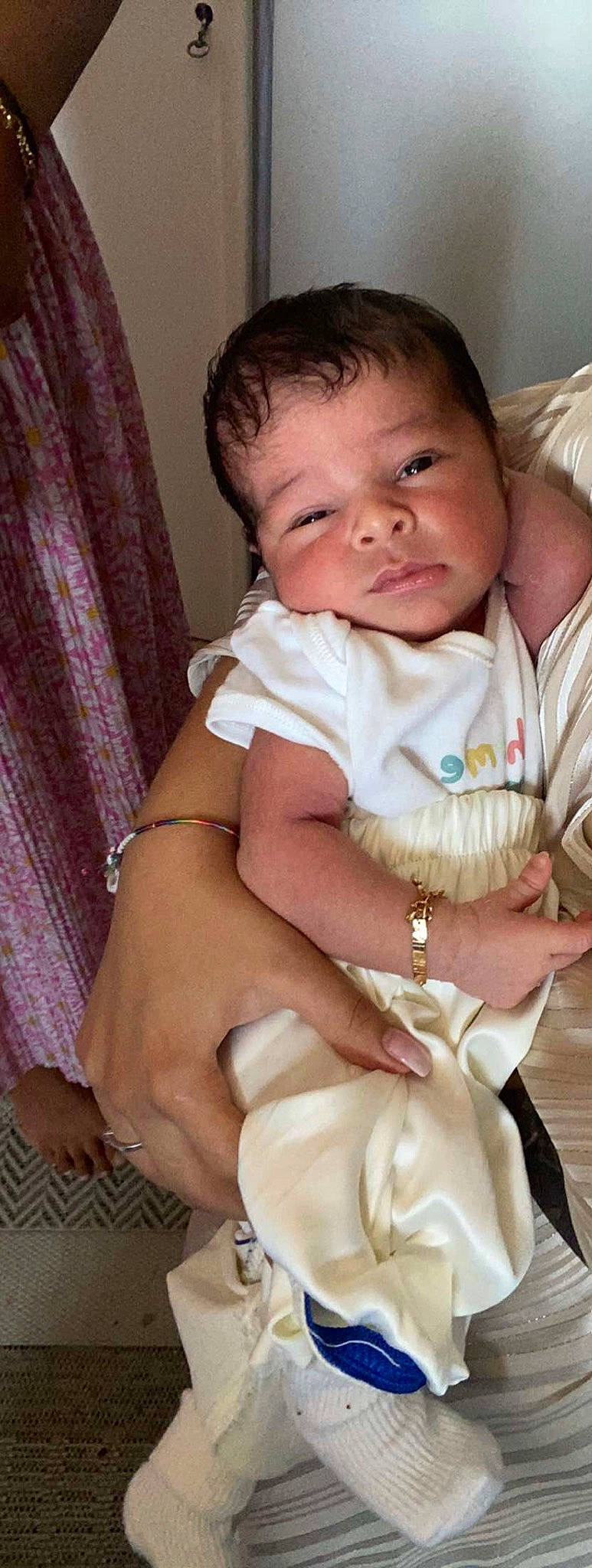 Imrân participe au concours pour gagner de l'argent avec cette photo : arm, baby, baby_toddler_clothing, cheek, child, curtain, dress, eye, eyebrow, finger, hand, head, iris, lip, nose, person, pink, skin, sleeve, thumb