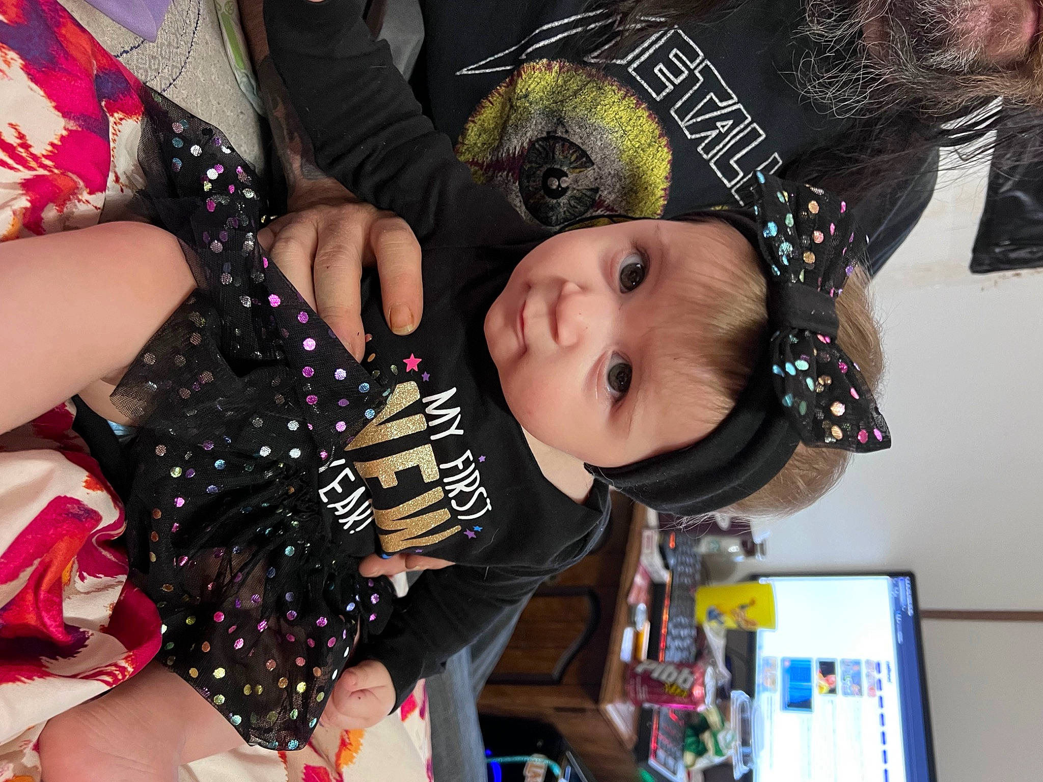 Genevieve is registered to the contest to win money with this photo: black, child, costume, event, fashion_accessory, fun, hair_accessory, happy, headwear, nail, party, party_supply, pattern, person, photograph, room, snapshot, textile, thigh, toddler