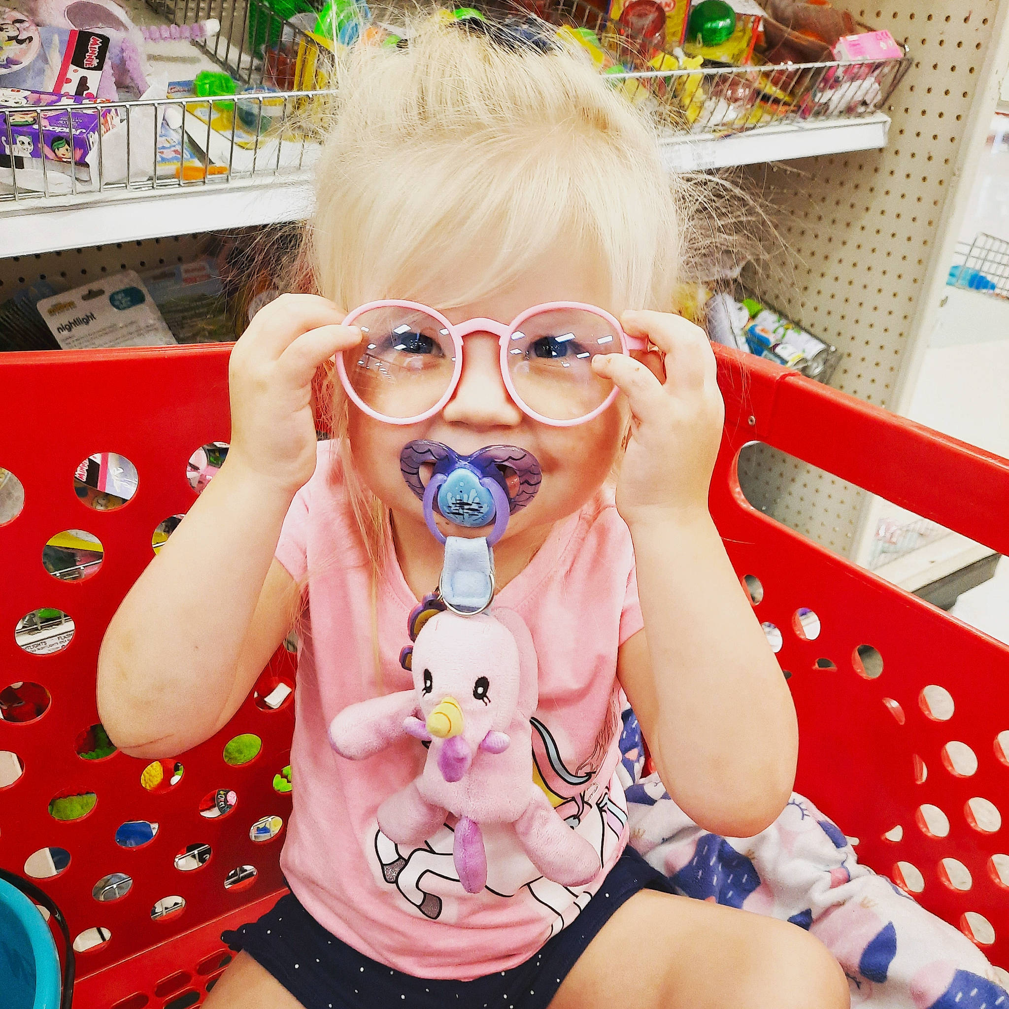 Scarlett joined the competition — help win amazing prizes! baby_toddler_clothing, cool, eyewear, facial_expression, finger, fun, glasses, goggles, happy, mouth, person, pink, shelf, skin, smile, sunglasses, textile, thigh, toddler, toy