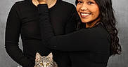 Rue joined the competition — help win amazing prizes! black_shirt, casual_clothing, cat, face_touch, friendship, gray_cat, happy, holding_cat, indoor, jeans, light_skin, long_hair, medium_skin, portrait, posing, short_hair, smiling, studio_background, tabby_cat, two_people
